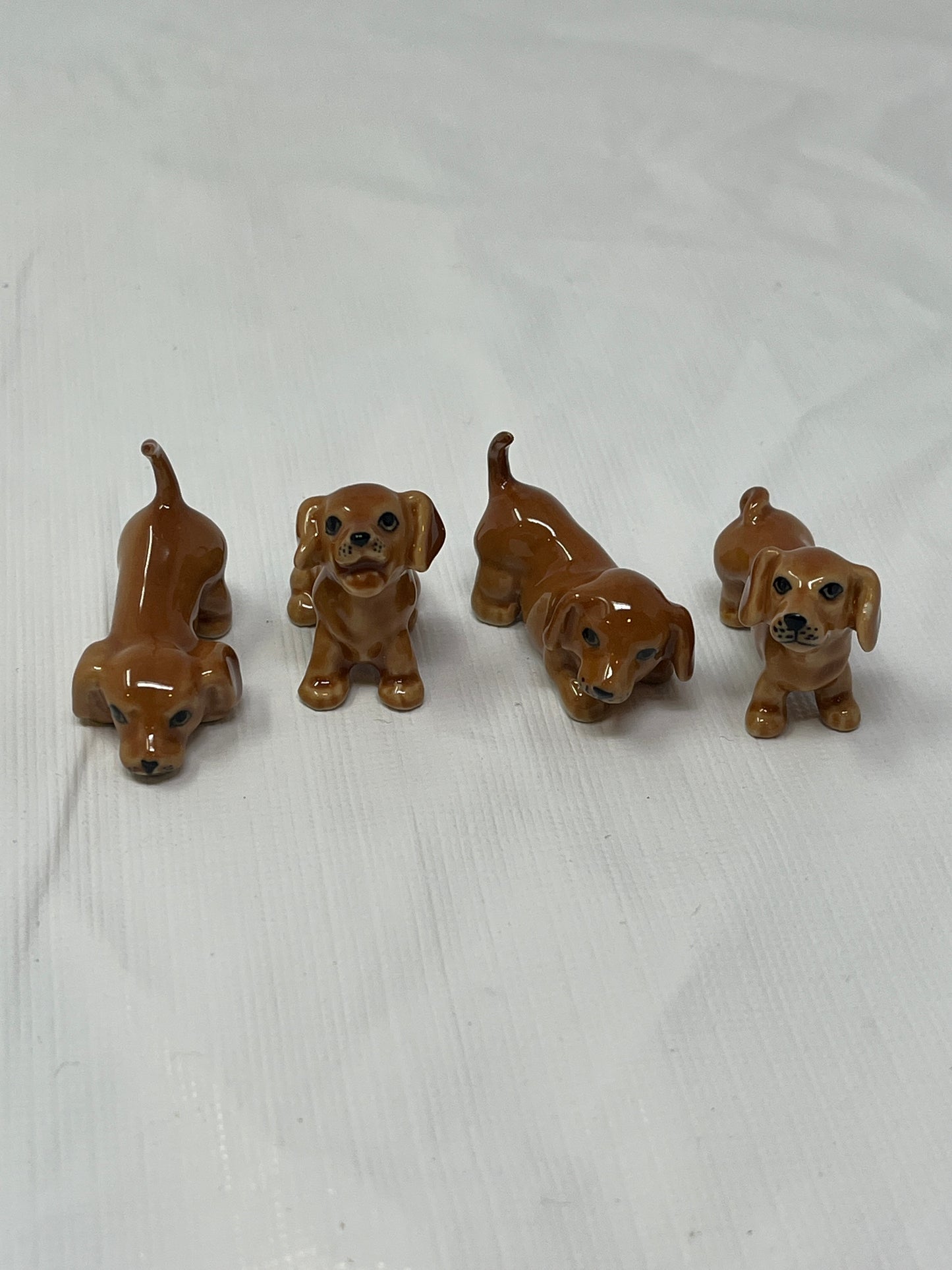 Set of 4 Miniature Ceramic Puppy Figurines – Brown, Hand-Painted